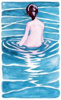 female nude sitting in water