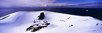 Snow covered hill at the seaside Penguin Island S