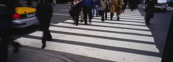 Group of people crossing at a zebra crossing