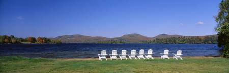 Group of lounge chairs near a lake