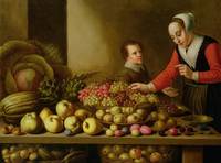 Girl selling grapes from a large table laden with